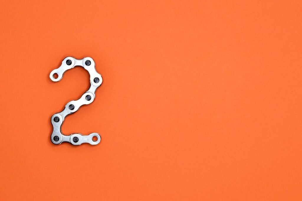 gray steel chain on orange surface